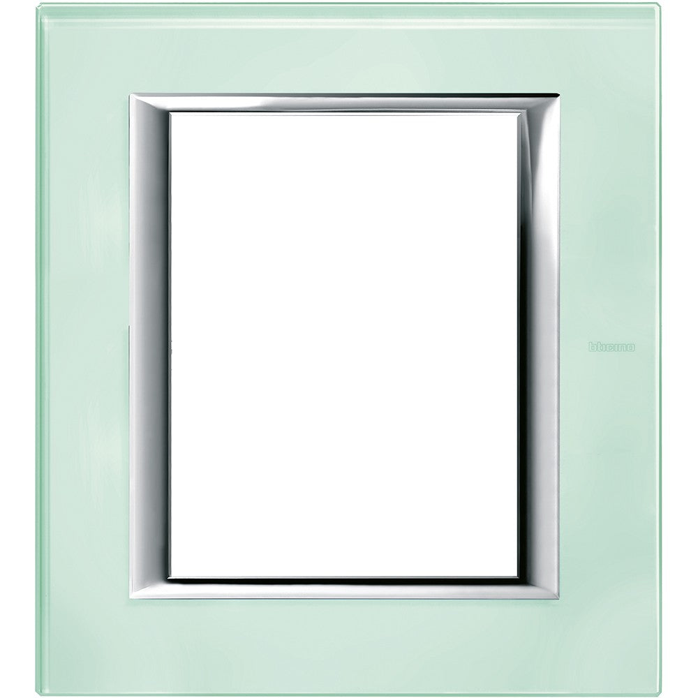 Bticino Axolute Placca 3+3P Vetro Kristall HA4806VKA, rectangular glass module cover in green with chrome trim.