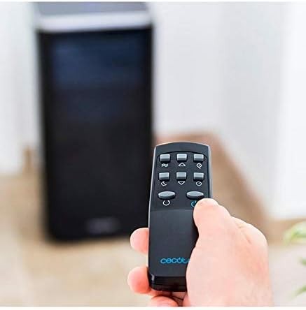 Remote control for the EnergySilence Clima 9250 air conditioner in a cozy indoor setting.