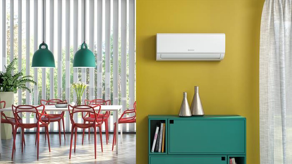 Olimpia Splendid Aryal S1 E Inverter 10 C mounted on a yellow wall in a modern interior with green decor.