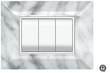 FEB Placca Flexi Plain 7F in Marmo Carrara color, with 7 designated spaces for switches.