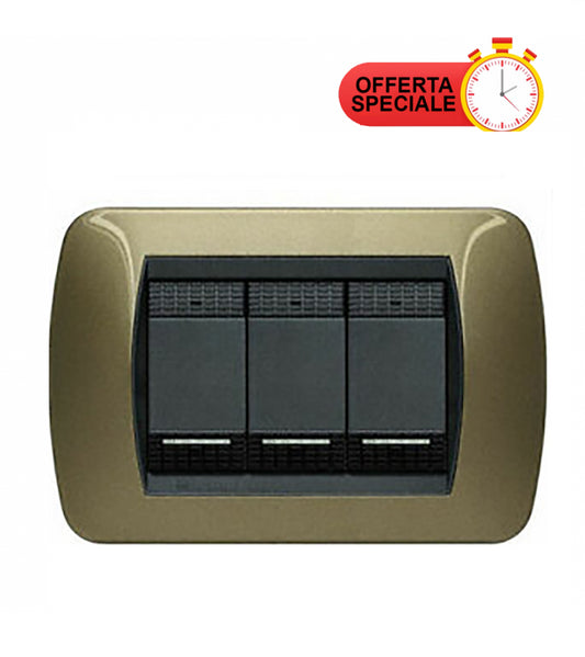 Three-gang metallic switch plate in ocher color, model BTICINO L4803OT from the LivingInternational series.