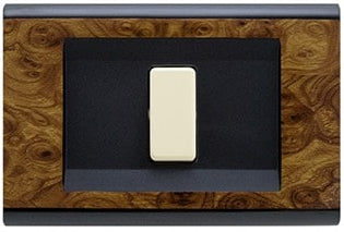 Placca Click 1F Radica 2581/RA by FEB, featuring a stylish radica wood texture with a modern switch design.